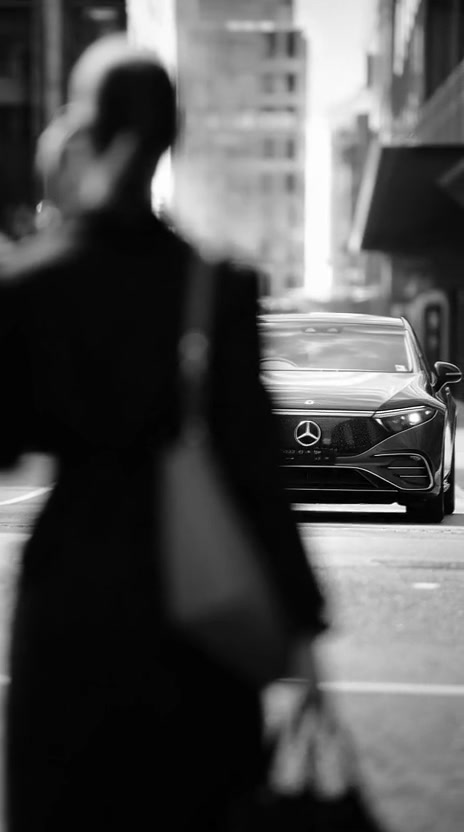 A traveller walking towards a waiting car