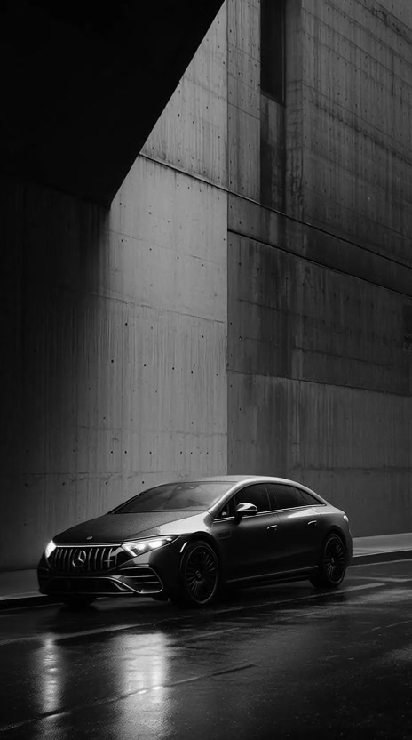 A black saloon waiting at a company entrance